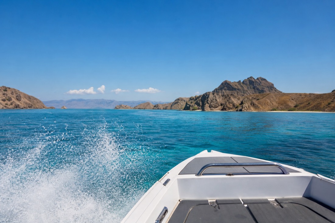 A speedboat crossing between islands in Komodo National Park