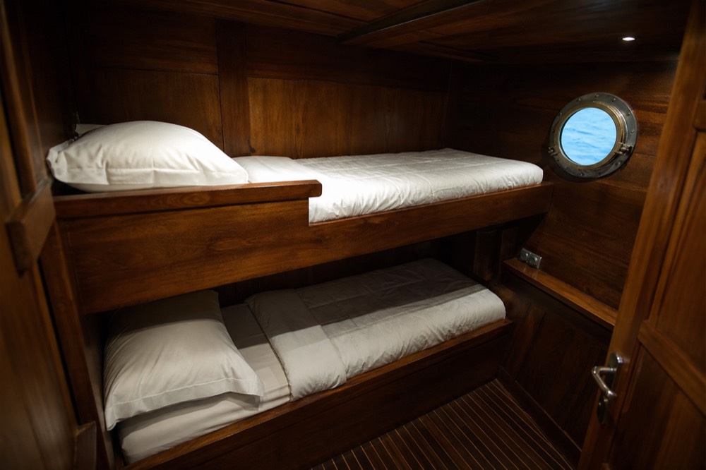 A traditional Phinisi liveaboard anchored in the park