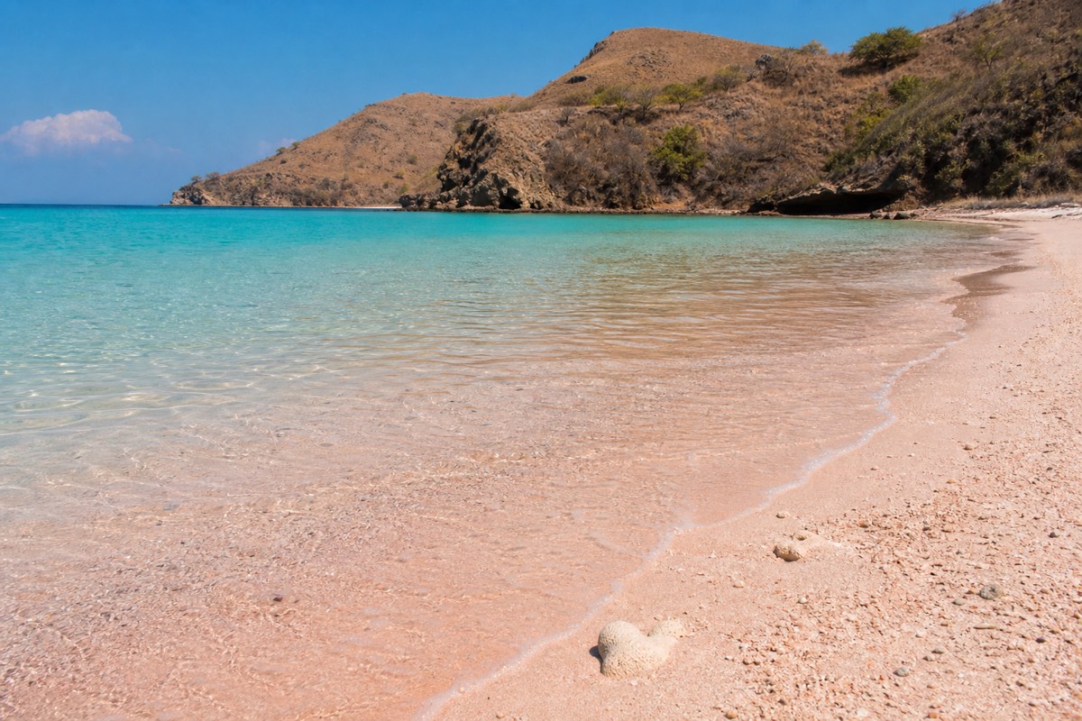 Pink-tinted sand meeting turquoise water at Pink Beach, Komodo National Park
